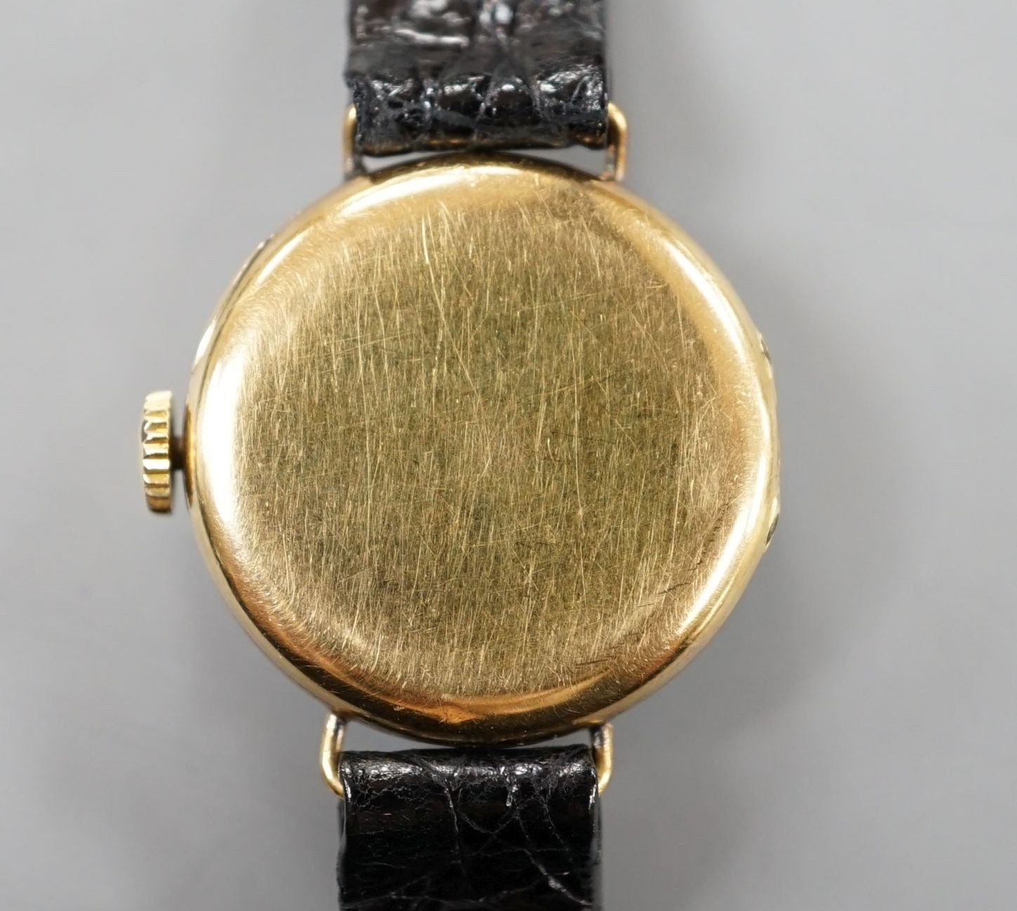 A lady's early 20th century 18k and diamond set manual wind wrist watch, on later leather strap